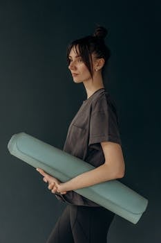 Woman Holding A Yoga Mat