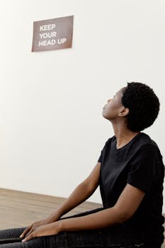 Woman in Black Shirt sitting on the Floor